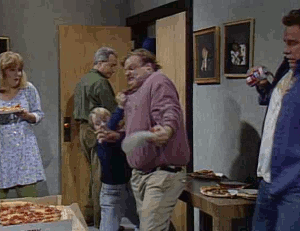 Chris Farley dives into pizza